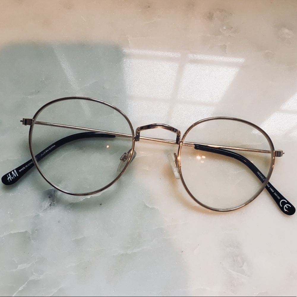 Gold rimmed eye glasses